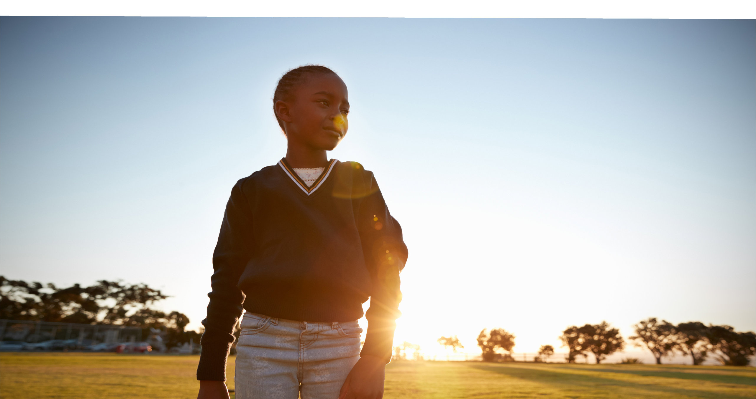 Young person with sunrise in backgroud