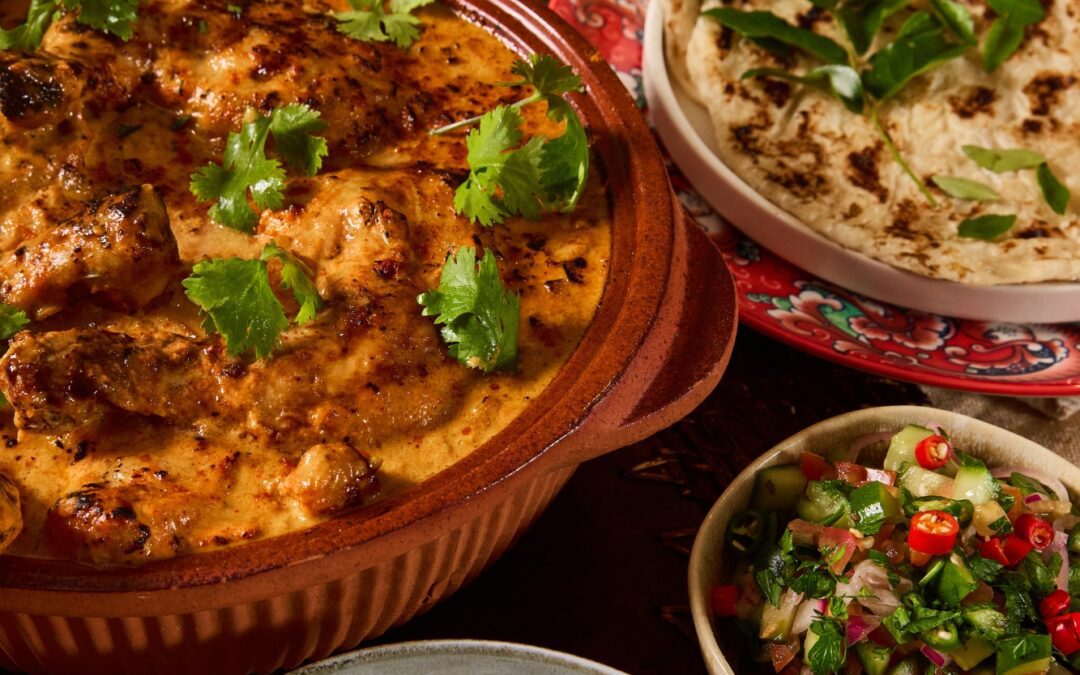 Tikka chicken curry with Dahl rice and sambals